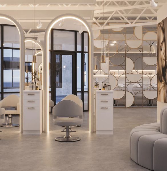 Luxury hair salon with arched LED mirror stations, white cabinets, and gold geometric accent wall.