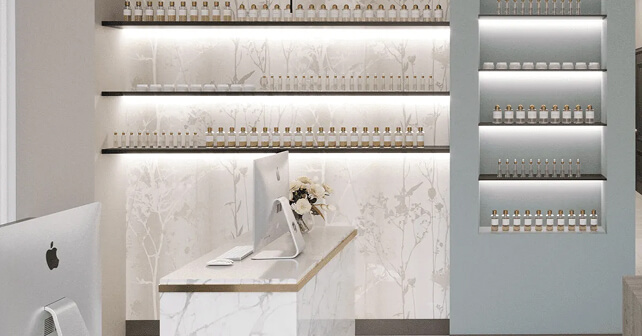 Modern Houston reception area with marble desk and back-lit product shelving