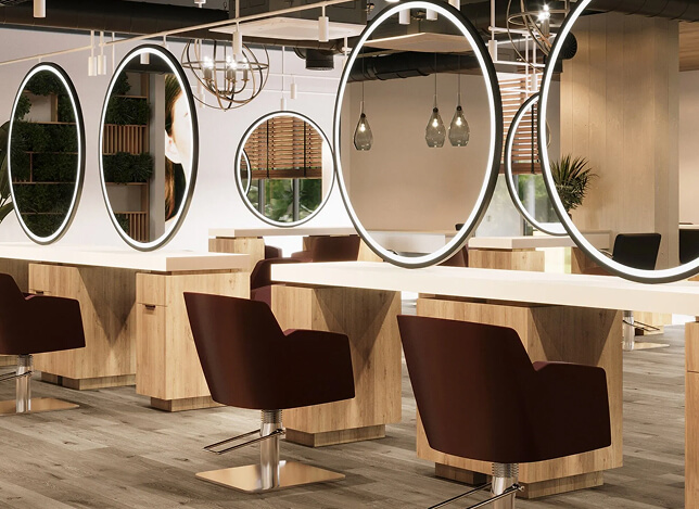 Contemporary Houston salon design with oval back-lit mirrors and burgundy chairs