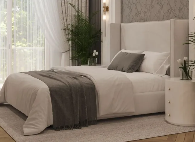 Elegant bedroom with neutral tones and luxurious bedding.