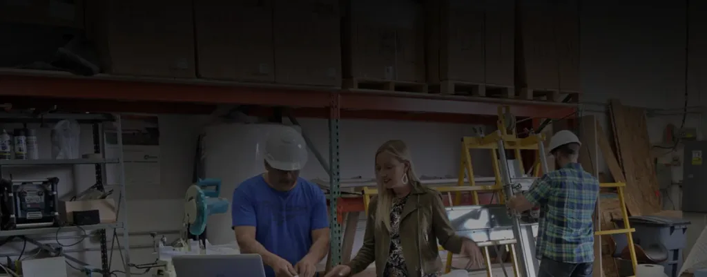 Team collaborating on interior design projects in a workshop setting.