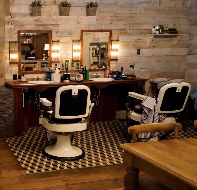 Vintage-style barbershop with classic barber chairs.