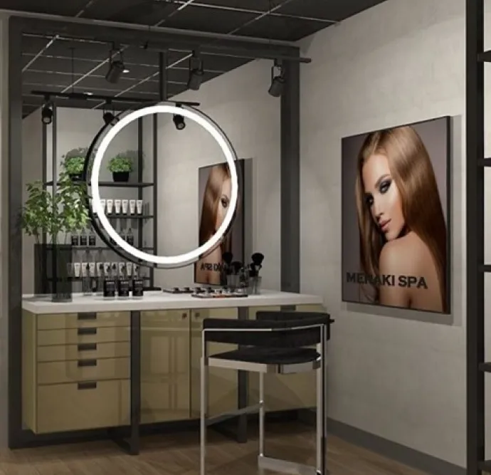 Spa vanity with a circular lighted mirror and product display.