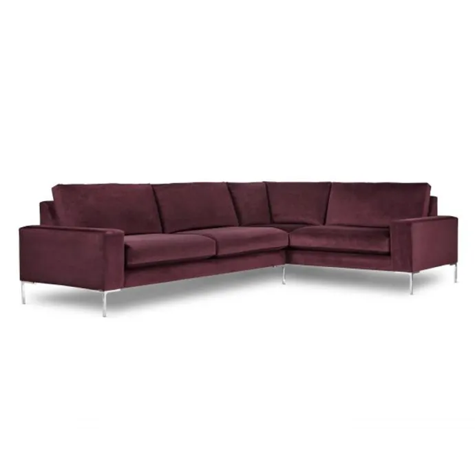 Rich burgundy sectional sofa with sleek metal legs.