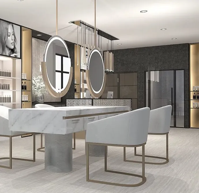 Minimalist salon setup with circular lighted mirrors and marble countertops.