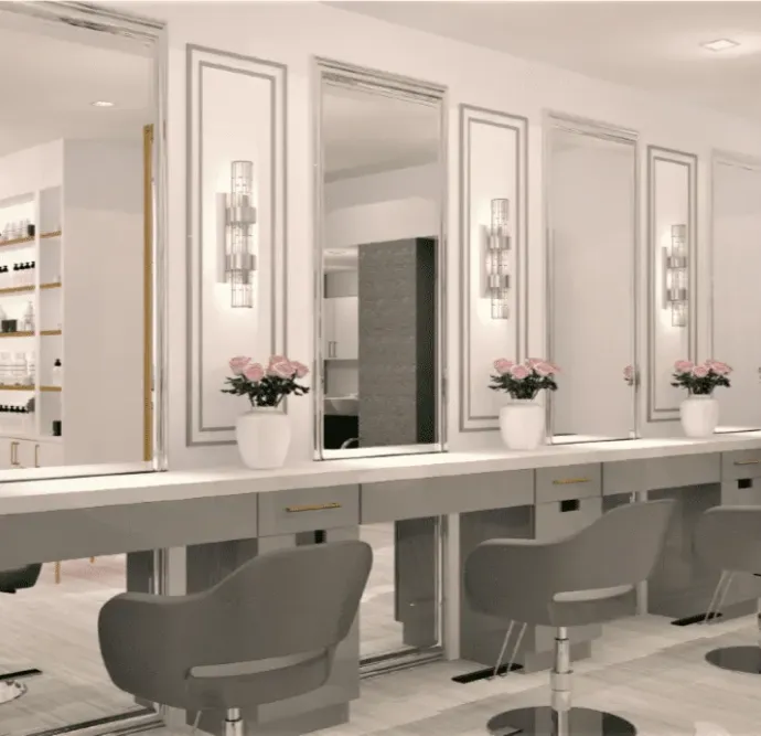 Elegant salon with gray and white styling stations and flower decor.