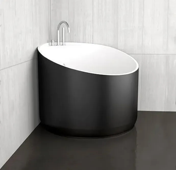 Contemporary corner soaking tub with a sleek black finish.
