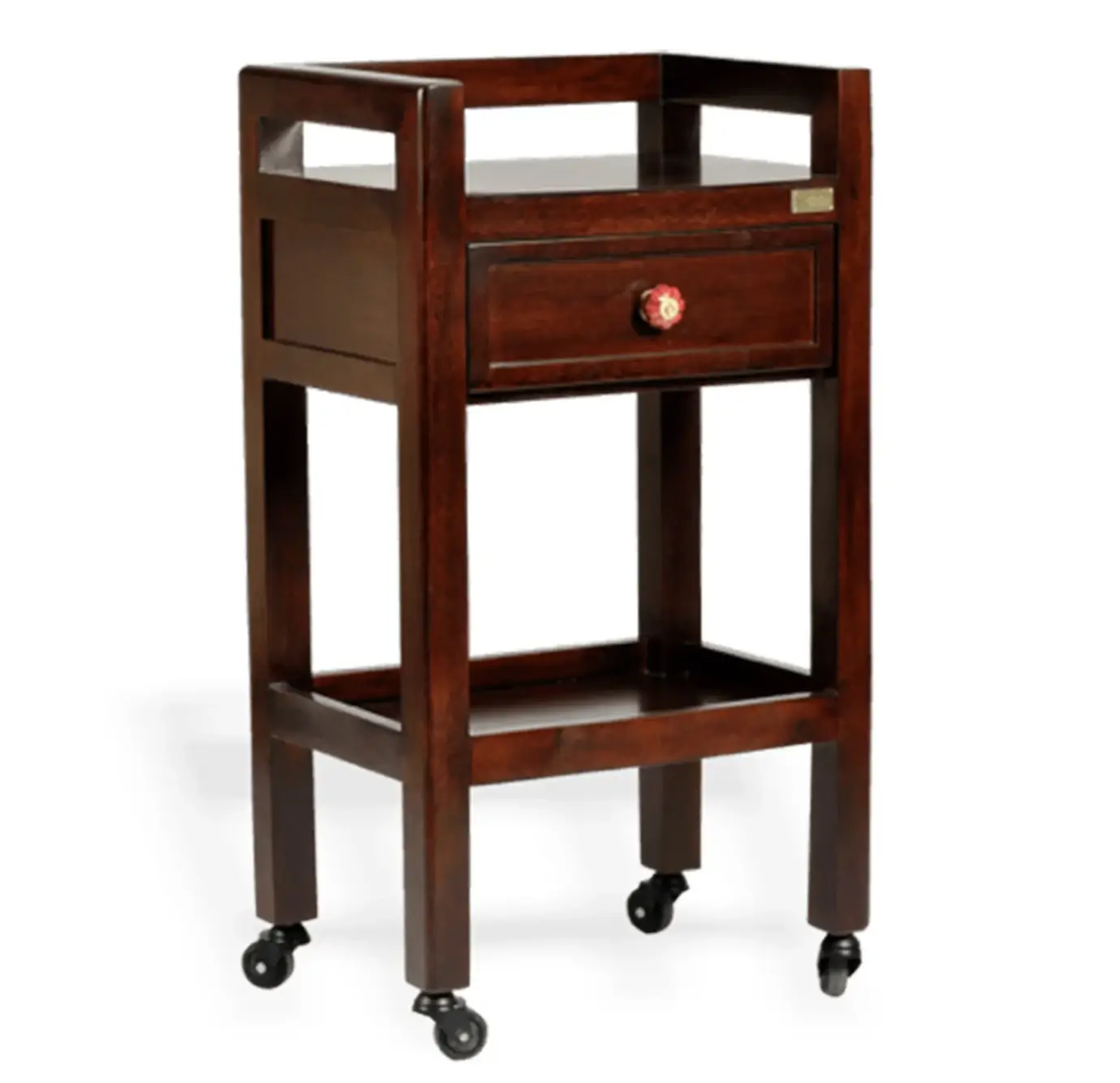 Dark walnut wood rolling side table with one drawer featuring a decorative red ceramic knob, open top shelf, lower storage shelf, and four caster wheels